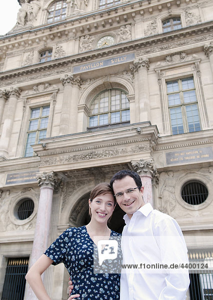 Happy couple outside the Louvre Paris