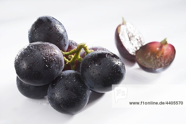Black grapes with drops of water