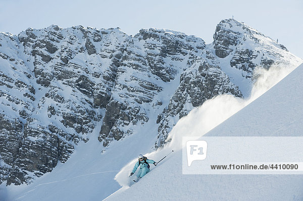 Austria  Woman skiing on arlberg mountain