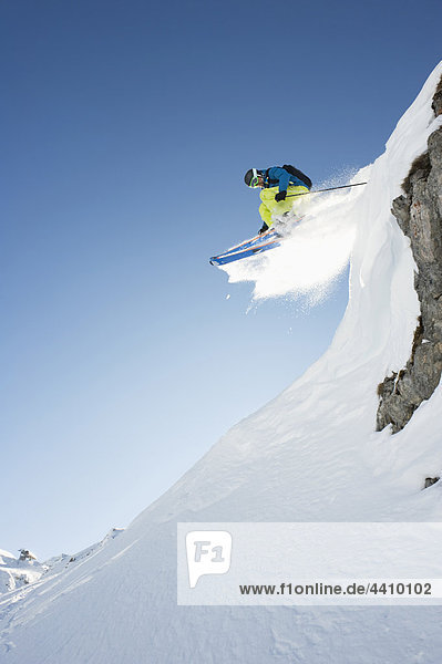 Austria  Man jumping on arlberg mountain
