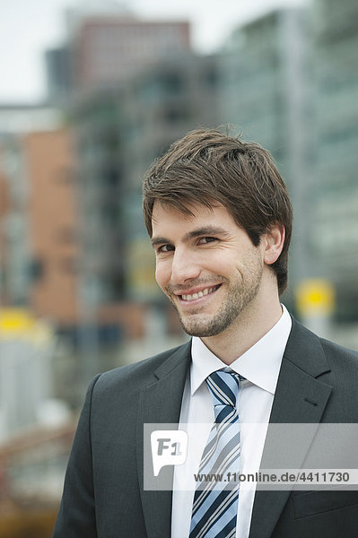 Germany  Hamburg  Businessman smiling  portrait