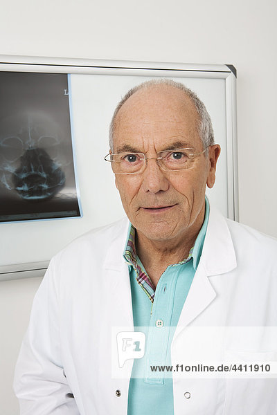 Germany  Munich  Doctor wearing spectacles  smiling  portrait