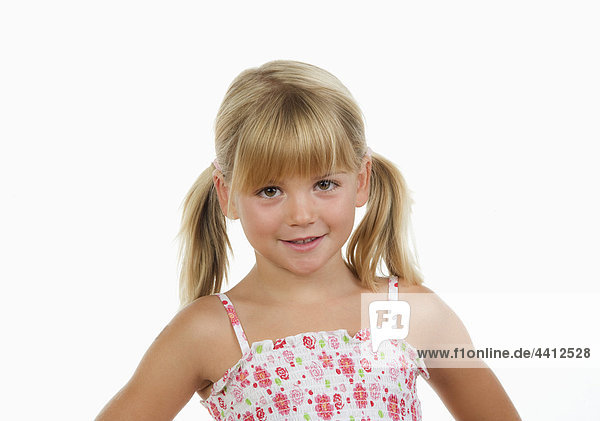 Girl (4-5) against white background  smiling  portrait