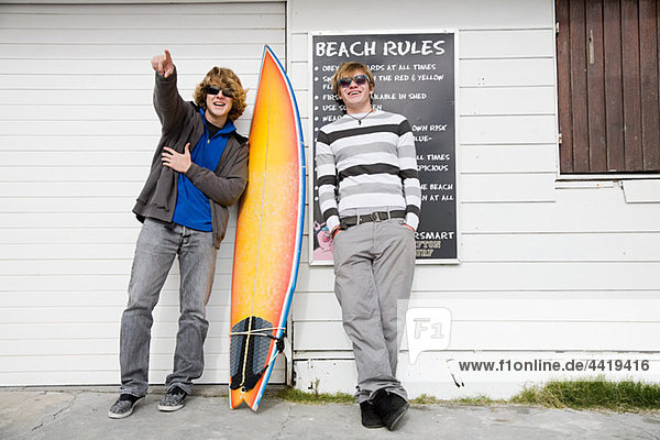 Teenage boys with surfboard