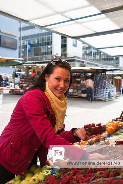Young woman shopping in fruit market