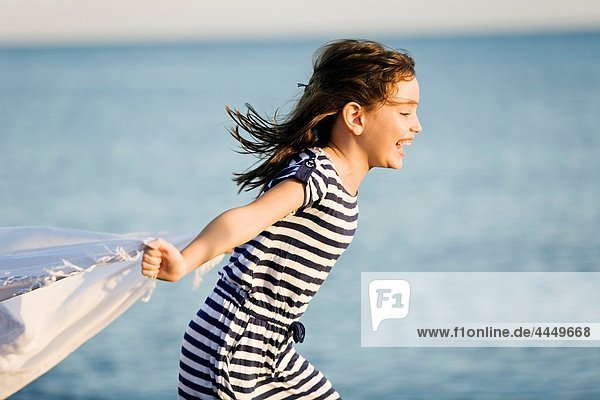 Girl running on a beach