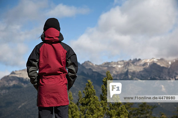 Rear view of a woman looking at a mountain view  Patagonia  Chile