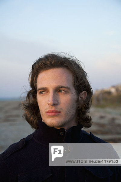 A young man at the beach  portrait