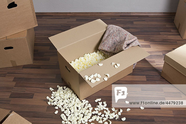 Moving boxes  packing peanuts and a drop cloth
