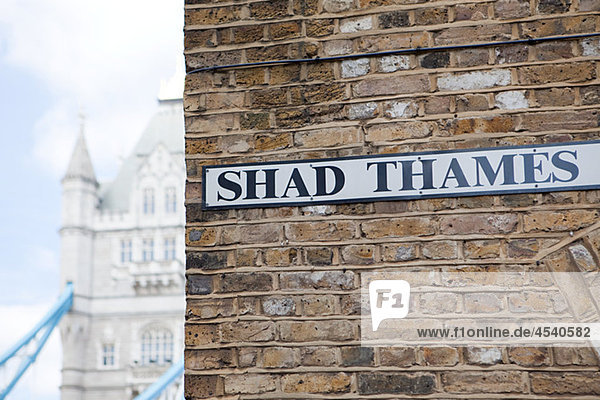 Shad Thames sign and Tower bridge  London