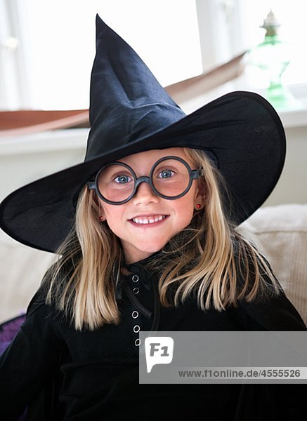 Portrait of girl wearing witchs hat