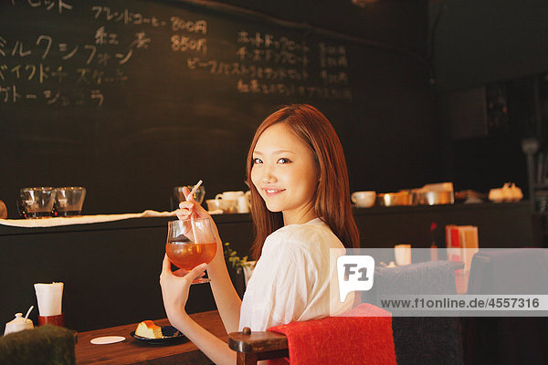 Japanese Woman Relaxing in Café