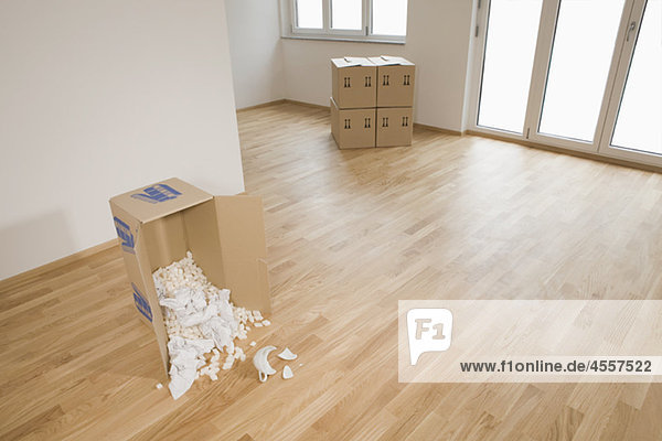 Stack of cardboard boxes in empty apartment Munich Bavaria Germany