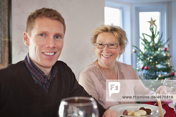 Man and woman eating christmas dinner