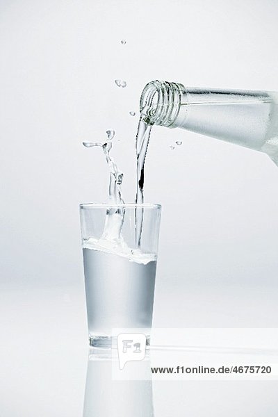 Pouring vodka into glass
