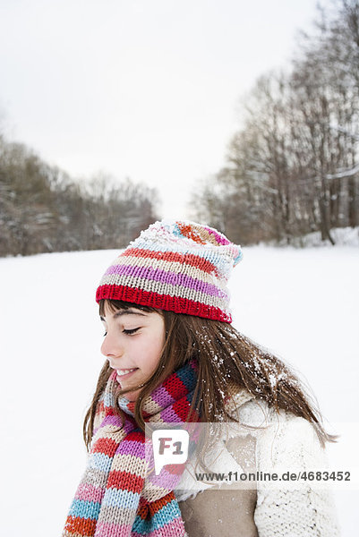 Girl standing in snowfield