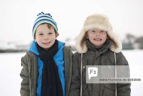 Two boys out in the snow