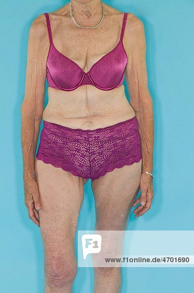 A senior woman modeling lingerie