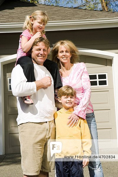 Family portrait outside house