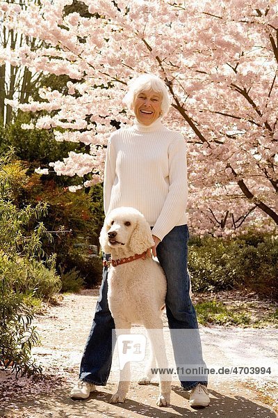 Portrait of senior woman with dog
