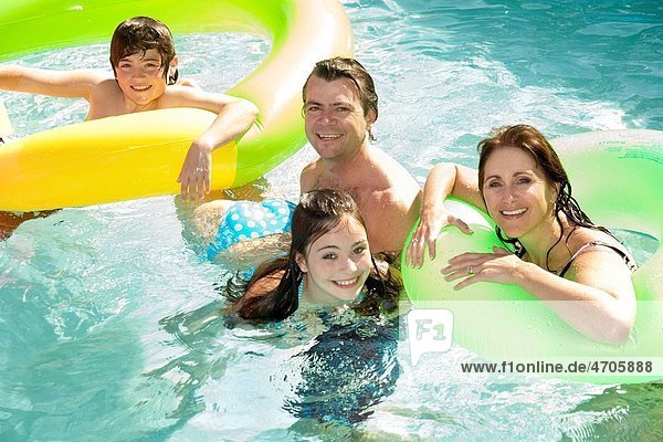 Family in swimming pool