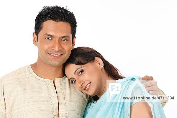 Wife resting her head on husband shoulder standing close to each other MR 703R 703S
