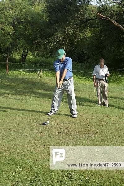 Golf player concentrated on ball MR 372
