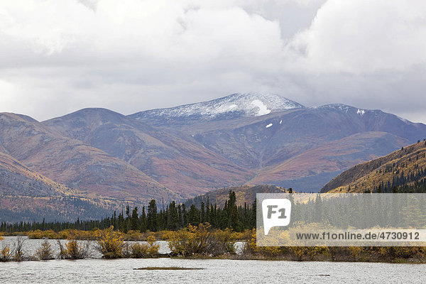 Fish Lake and surrounding sub-alpine tundra  Indian summer  leaves in fall colours  autumn  Yukon Territory  Canada