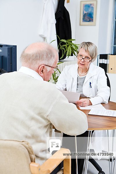 Doctor and patient talking in clinic