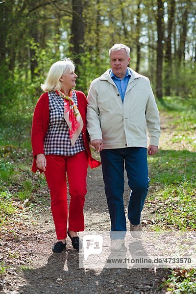 Senior couple walking in park