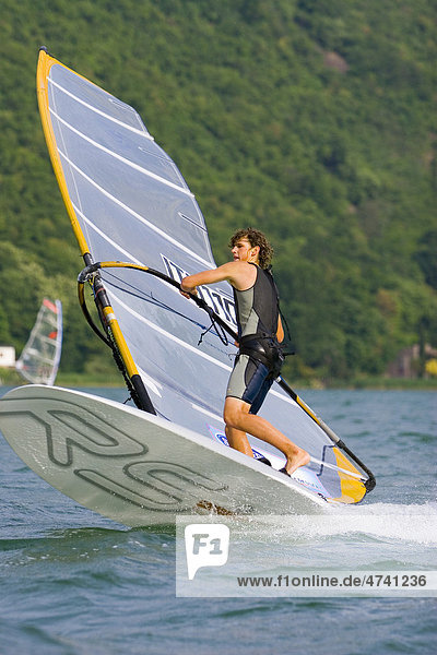 Wind surfer surfing on Lake Kaltern Province of Bolzano-Bozen Italy Europe