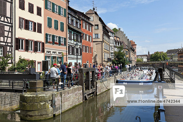 Tourist boat travelling through a lock on the Ill River  Petite France  Strasbourg  Alsace  France  Europe