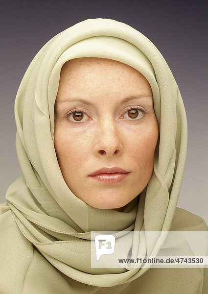 Young woman wearing a head scarf  portrait