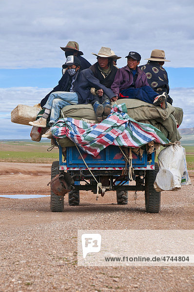 Tibetan pilgrims on a tractor on the road from Gerze to Tsochen  Western Tibet  Tibet  Asia