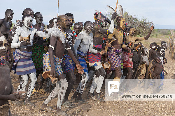 Karo people with body paintings participating in a tribal dance ceremony  Omo river valley  Southern Ethiopia  Africa