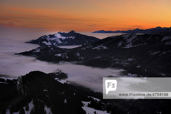 Sunrise above mountain tops with fog in winter  Sonthofen  Allgaeu  Bavaria  Germany  Europe