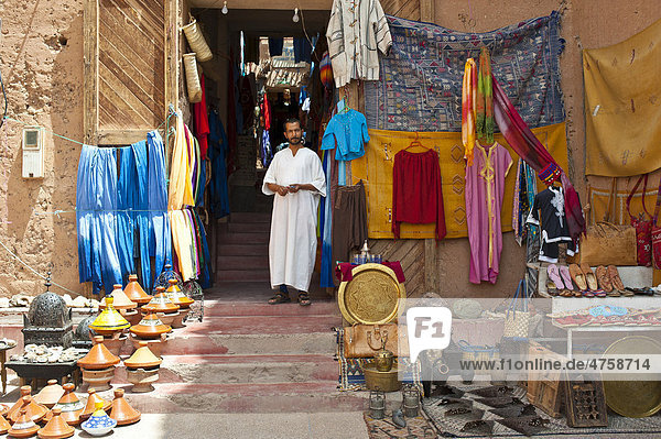 A seller and his merchandise in the souk  bazaar  Ouarzazate  Morocco  Africa