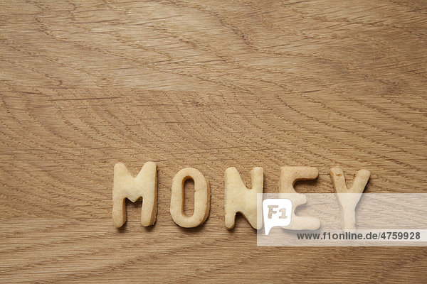 Money  word written with biscuits
