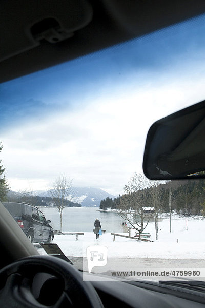 Going on winter holiday by car  lakeshore of Walchensee or Lake Walchen  Bavaria  Germany  Europe