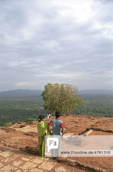 Sigiriya  locals on the rocks with fortress ruins  Unesco World Heritage Site  Sri Lanka  Asia