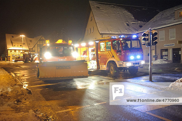 Winter services scattering salt on the road ice hazard through water used for for firefighting Kirchheim unter Teck Baden-Wuerttemberg Germany Europe