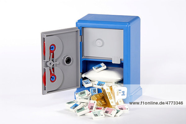 Money and gold in a toy safe  symbolic image
