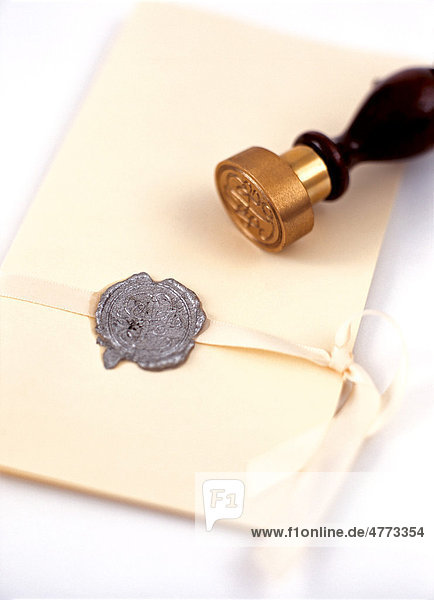 Envelope with a wax seal and a seal stamps  wedding
