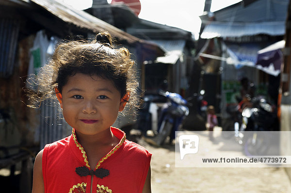 Urak Lawoi sea gypsy girl in a red dress  Rawai  Phuket  south Thailand  Asia