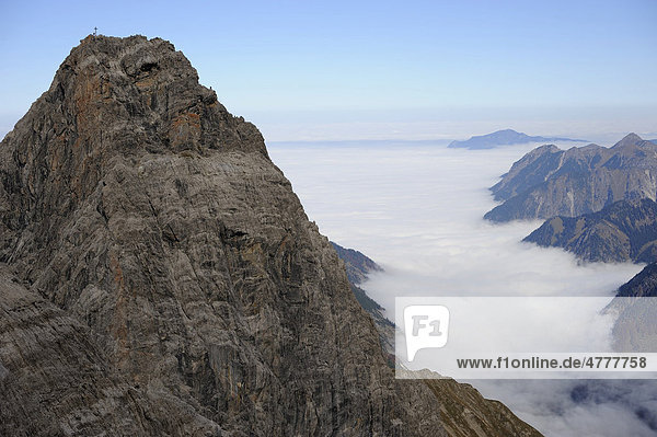 Peak in front of fog in the valley  Allgaeu Alps  Kleinwalsertal valley  Vorarlberg  Austria  Europe