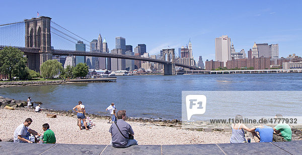 Brooklyn Bridge and skyline of Manhattan seen from Fulton Ferry in Brooklyn  New York  USA