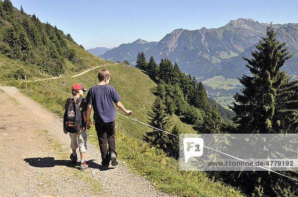 Two hiking boys  Soellereck  Allgaeu Alps  Bavaria  Germany  Europe
