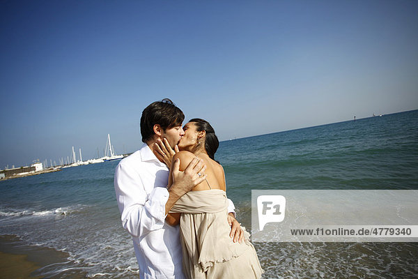 Kissing couple on the beach