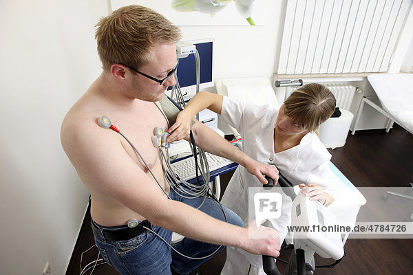 Medical practice  stress ECG  test to measure the cardiac function of a patient on a cardio machine