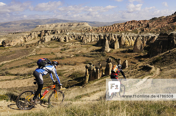 Mountain bikers at Cavusim  Goreme Valley  Cappadocia  Turkey  Western Asia